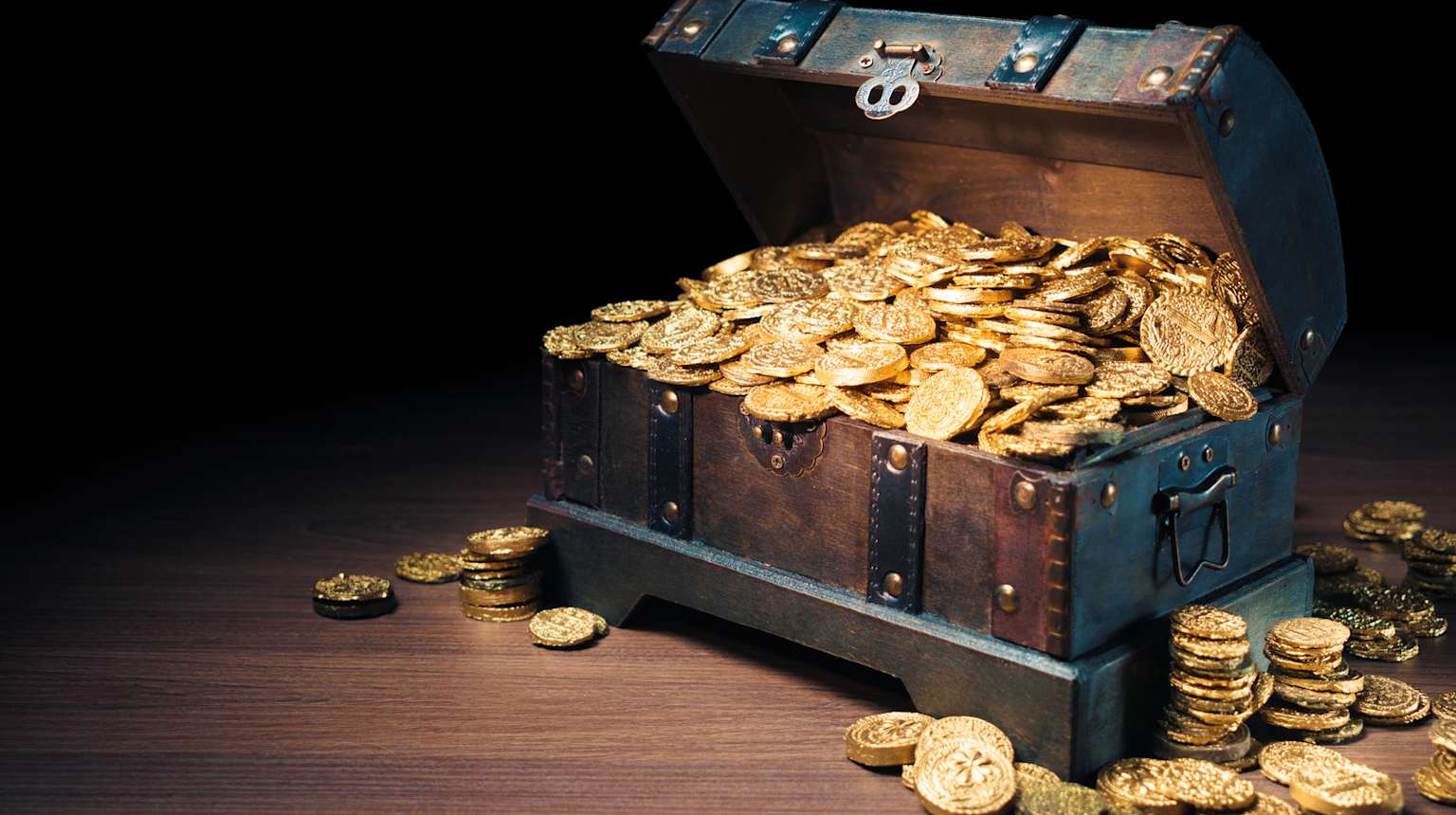 Richly detailed display of gold chalices, monstrances, and religious icons representing the lost wealth of Lima