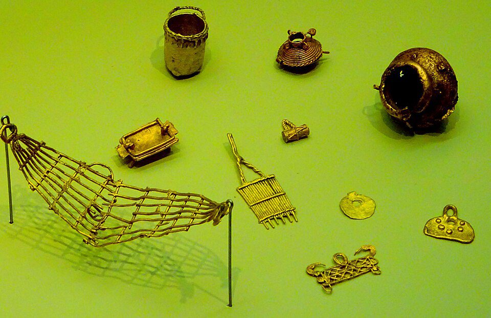 Small, highly detailed pre-Columbian gold figures known as tunjos
