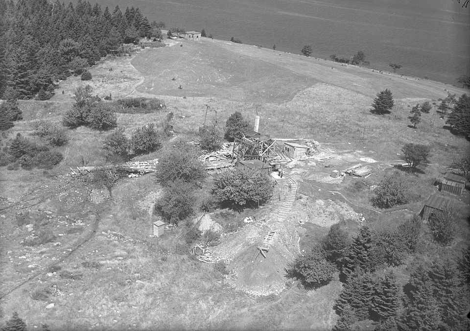 Archival black and white photo of massive wooden excavation equipment digging at the Oak Island money pit in 1931