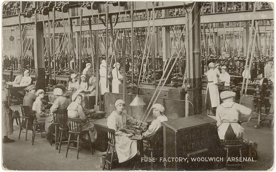Historical photograph of workers in the fuse factory at Woolwich Arsenal during the industrial era