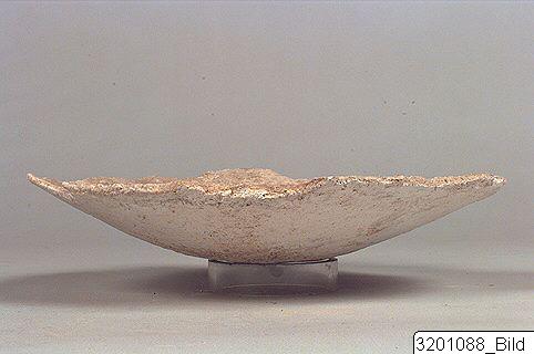 An ancient pottery jar painstakingly glued back together in antiquity.