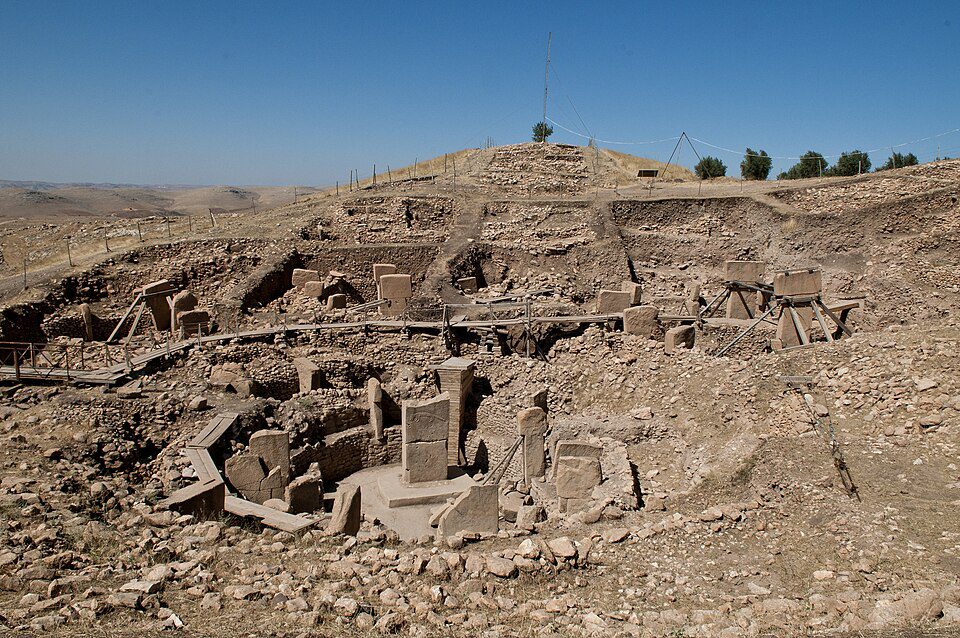Göbekli Tepe Archaeological Site Göbekli Tepe archaeological excavation site showing massive T-shaped stone megaliths carved with animal reliefs in southeastern Turkey