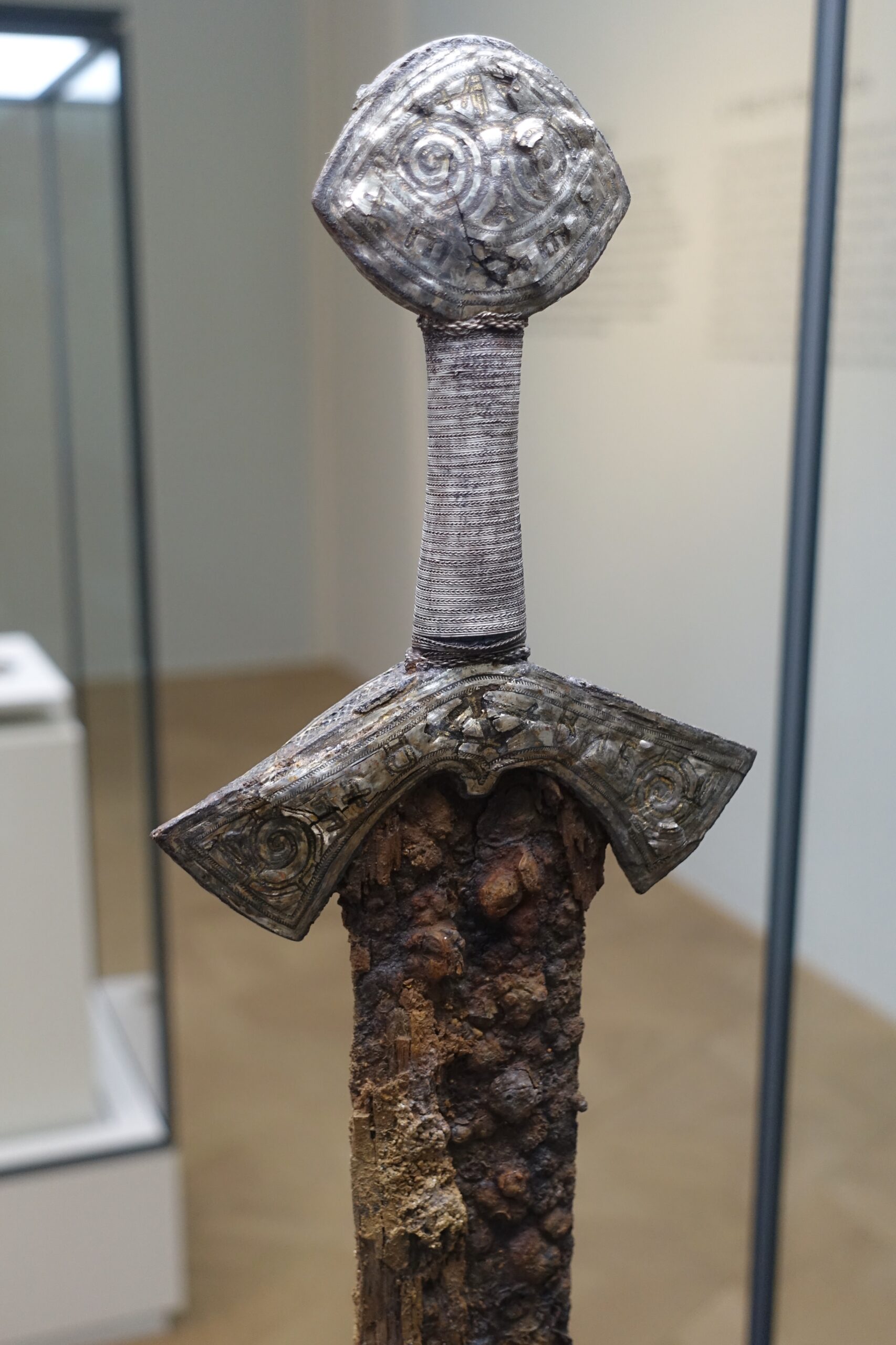 Viking sword hilt with gold and silver inlay
