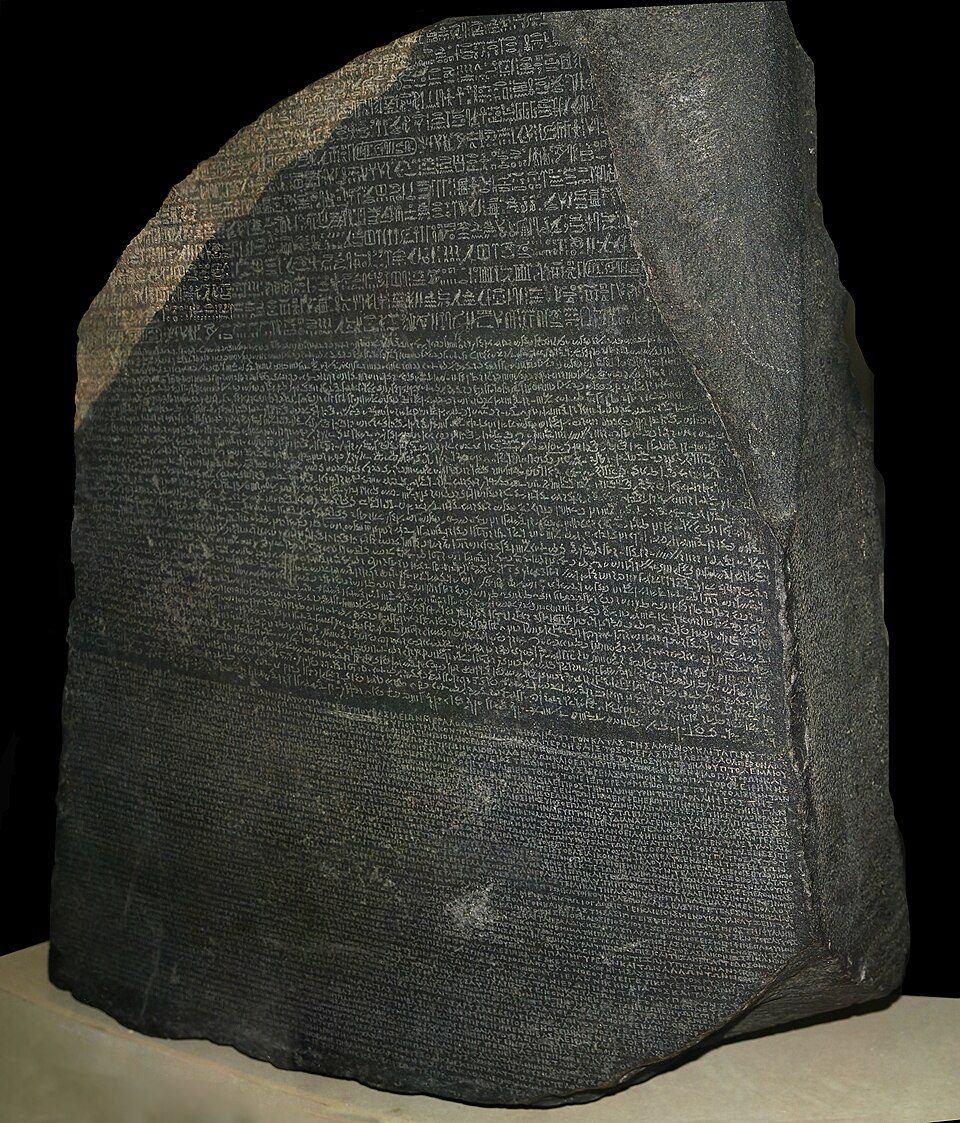 The Rosetta Stone, a granodiorite stela bearing a Ptolemaic decree in hieroglyphic, demotic, and Greek.