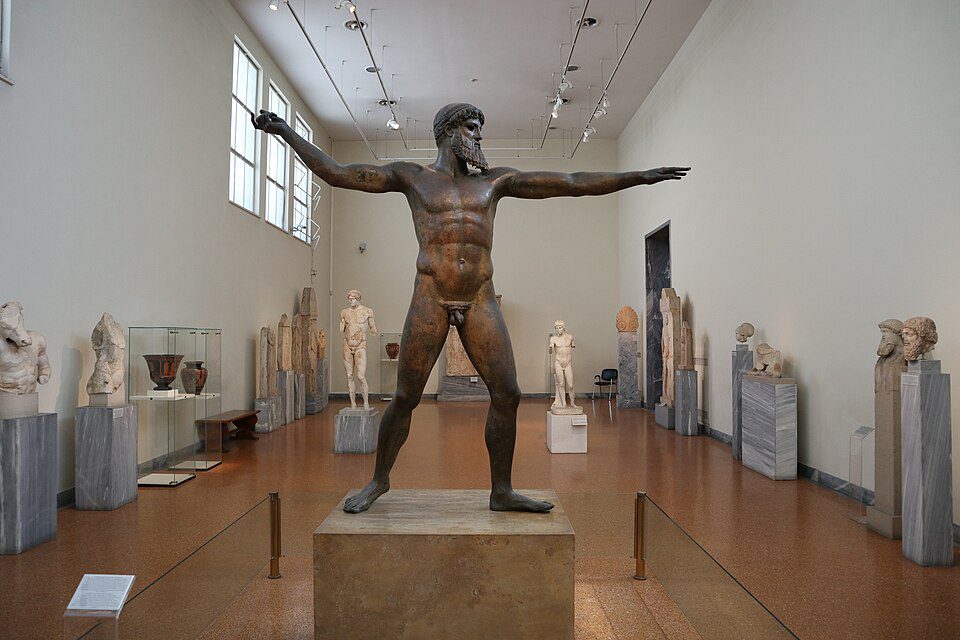 The Artemision Bronze, a Greek statue of a striding god, either Zeus or Poseidon, with an outstretched arm once holding a thunderbolt or trident