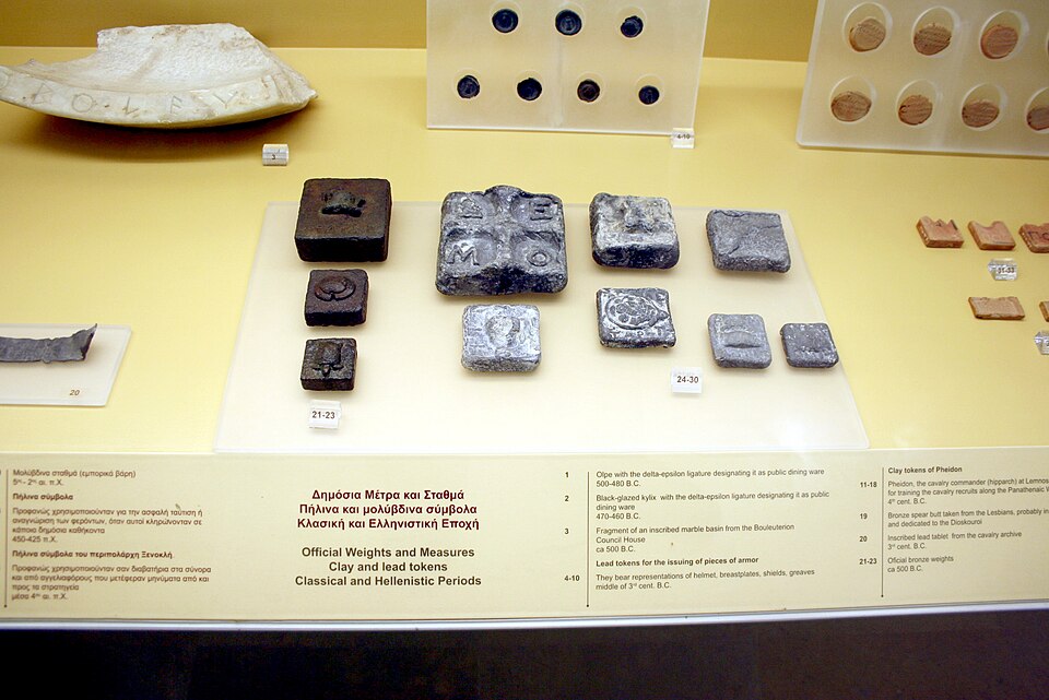Small square ancient lead market weight from Athens.