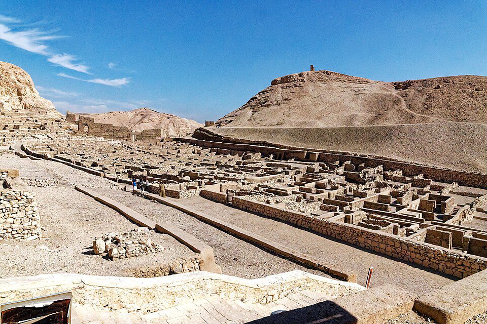 Stone foundations and narrow streets of the ancient walled workmen's village at Deir el-Medina, Egypt