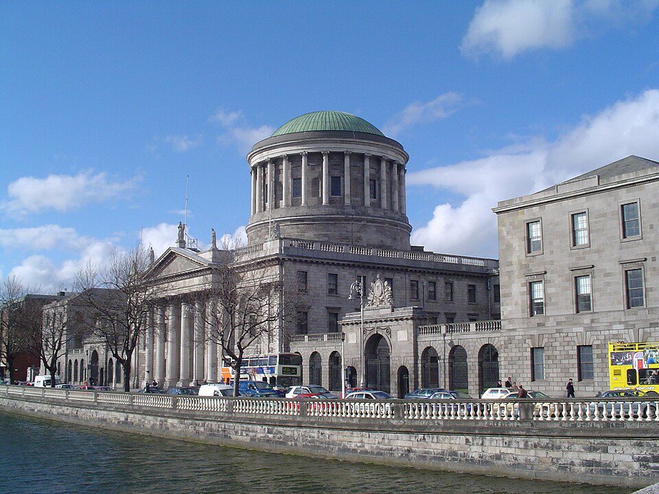 Modern Four Courts Complex Modern exterior view of Dublin Four Courts building along the River Liffey quayside today.
