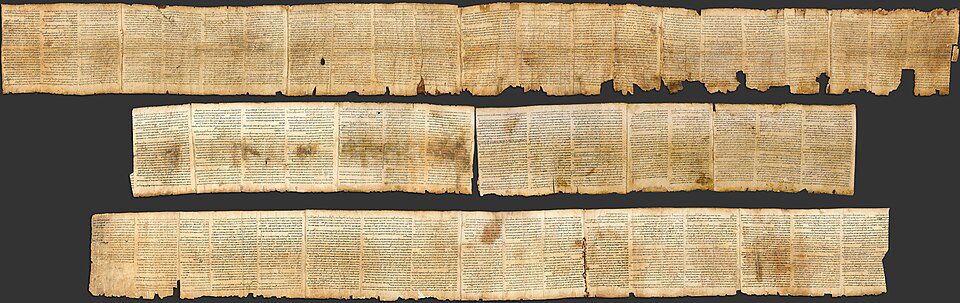 Long parchment scroll displaying columns of ancient Hebrew text