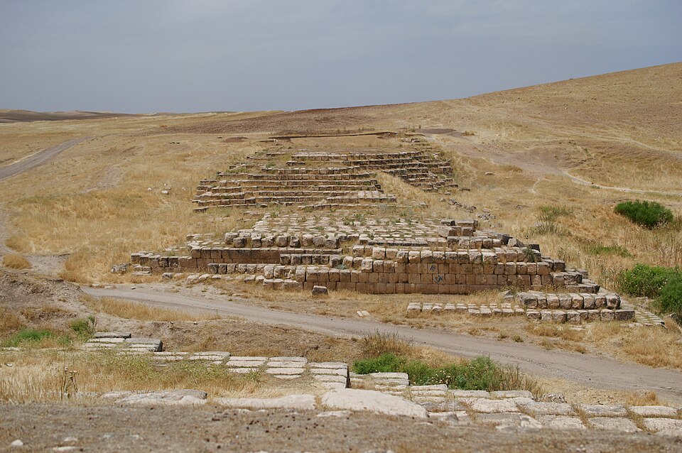 Massive stone blocks forming the ruins of the Jerwan Aqueduct.