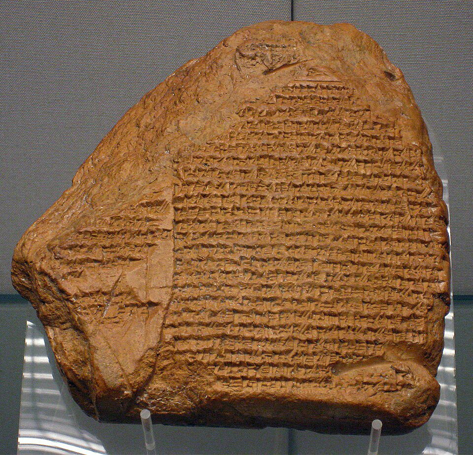 Rectangular clay tablet inscribed with tight rows of cuneiform script recording historical events