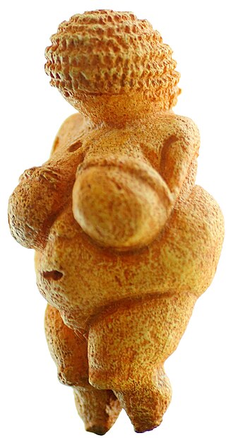 Small limestone statuette of a female figure with exaggerated body features and a textured braided head