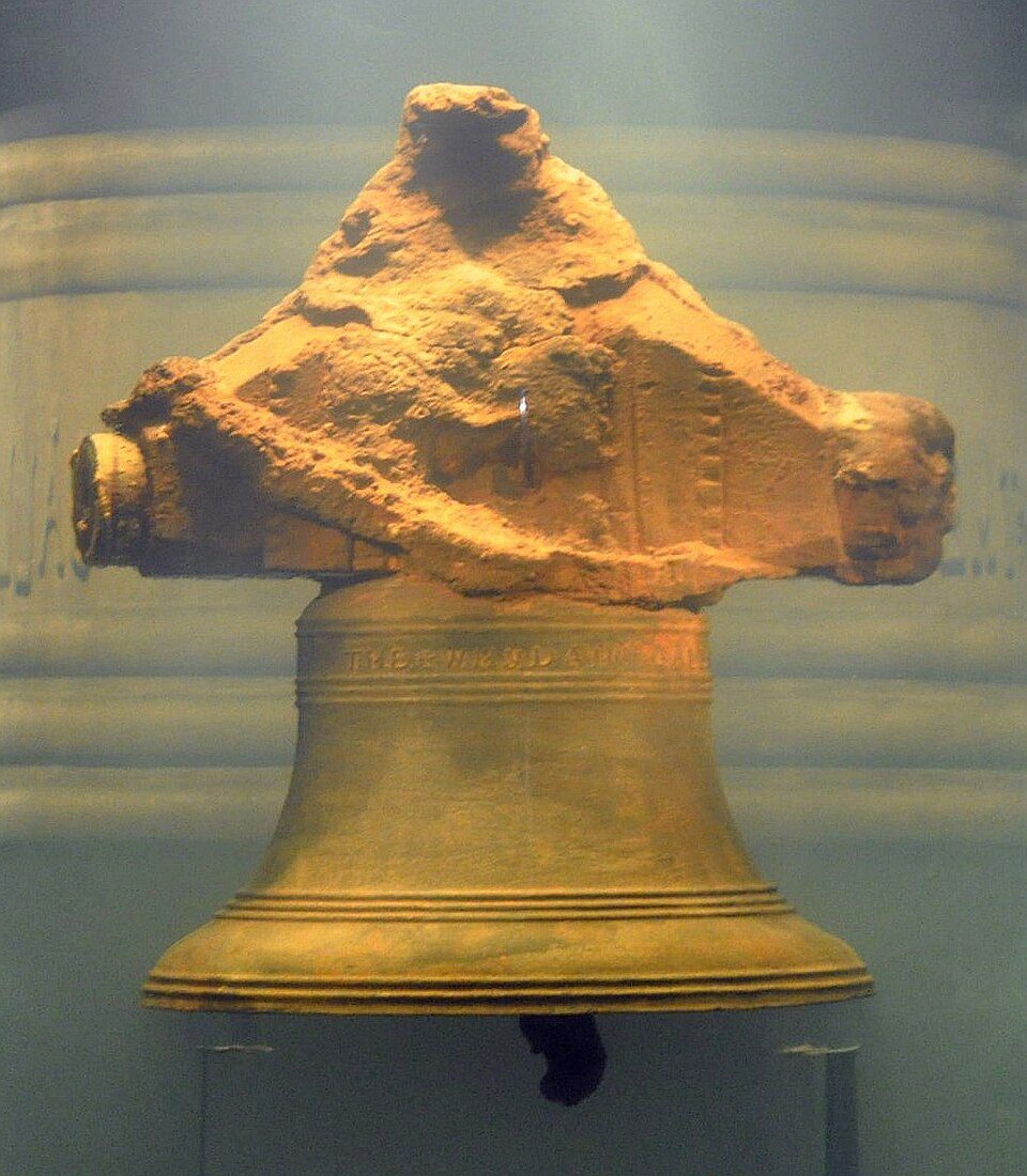 A bronze ship's bell inscribed THE WHYDAH GALLY 1716, recovered from the pirate shipwreck