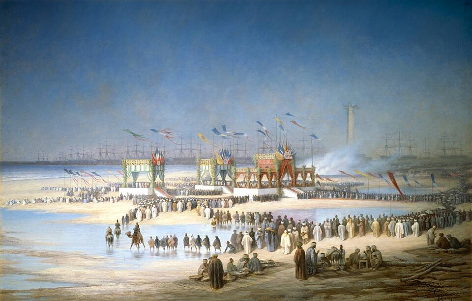 A grand nineteenth century oil painting showing an armada of ships and ceremonial pavilions on a desert coast.